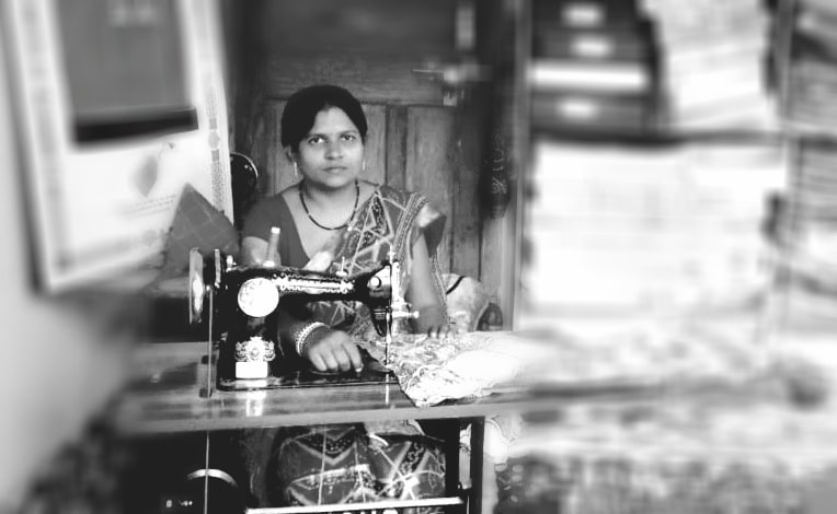 An artisan at her sewing machine