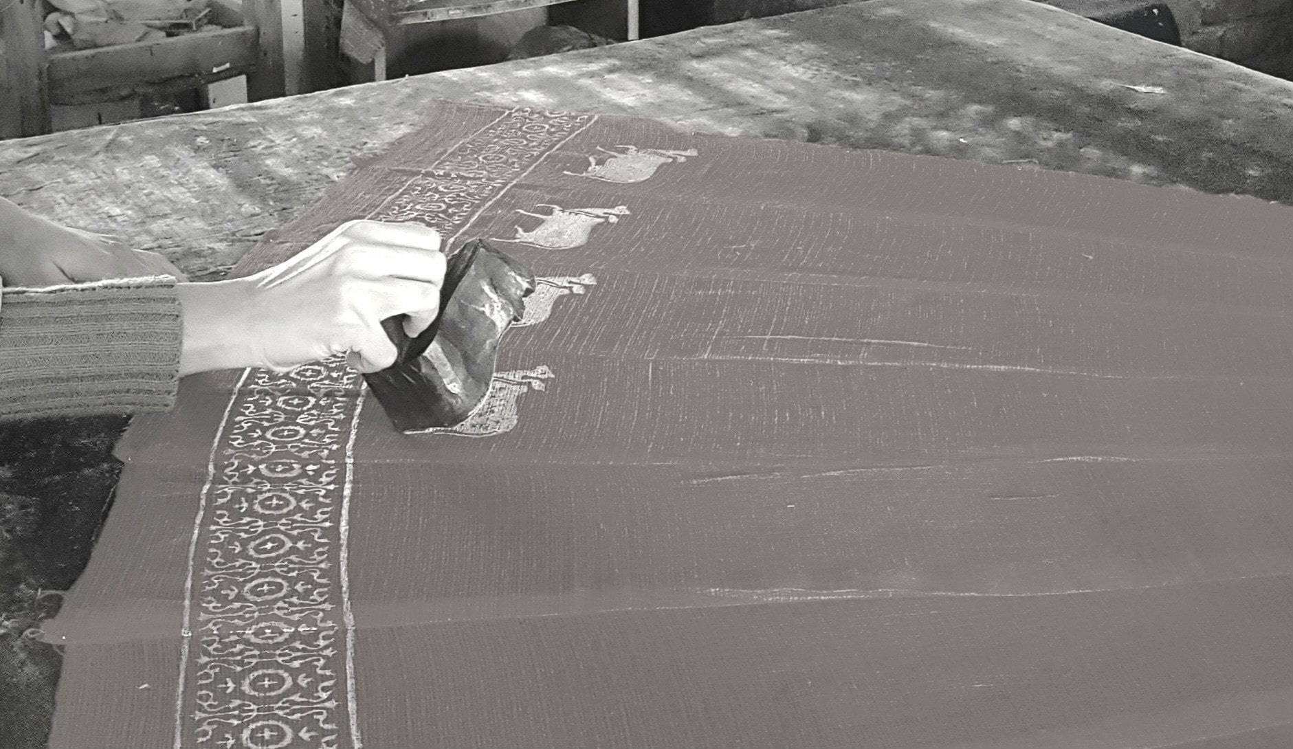 Hand block-printing a textile